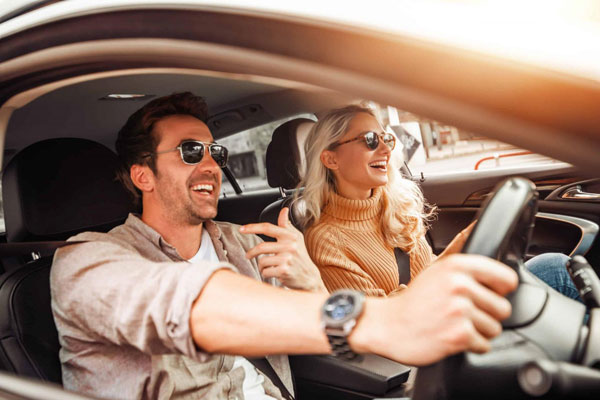 Couple driving happily